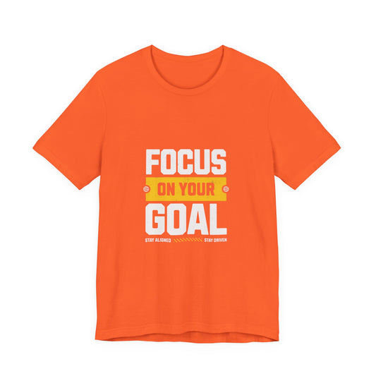 Men orange short-sleeve crewneck t-shirt with a graphic on the chest that reads 'FOCUS ON YOUR GOAL' in white and yellow text, displayed on a solid white background | AH Urban Wear PK