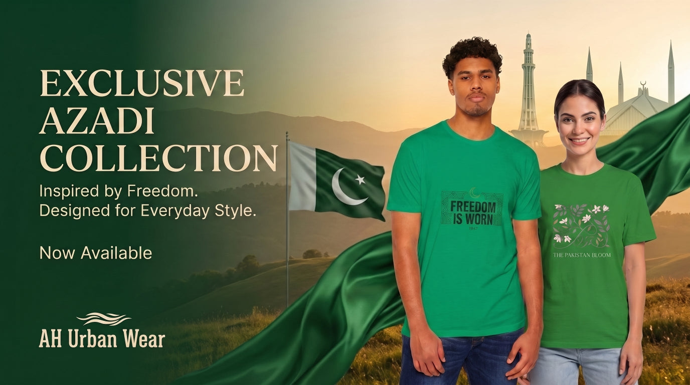 Two models wearing green t-shirts stand in front of a scenic background featuring the Pakistan flag, with text reading 'EXCLUSIVE AZADI COLLECTION' and the brand 'AH Urban Wear'.