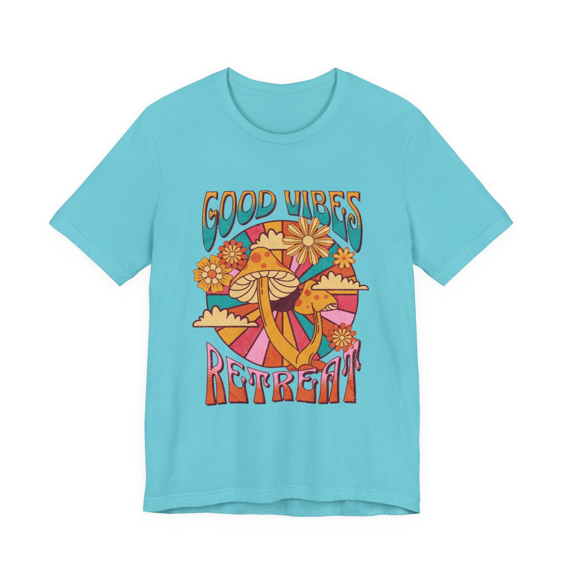 Women light blue short-sleeve t-shirt with a colorful retro 1960s-style graphic on the front featuring mushrooms, flowers, and the words 'GOOD VIBES RETREAT' | AH Urban Wear PK