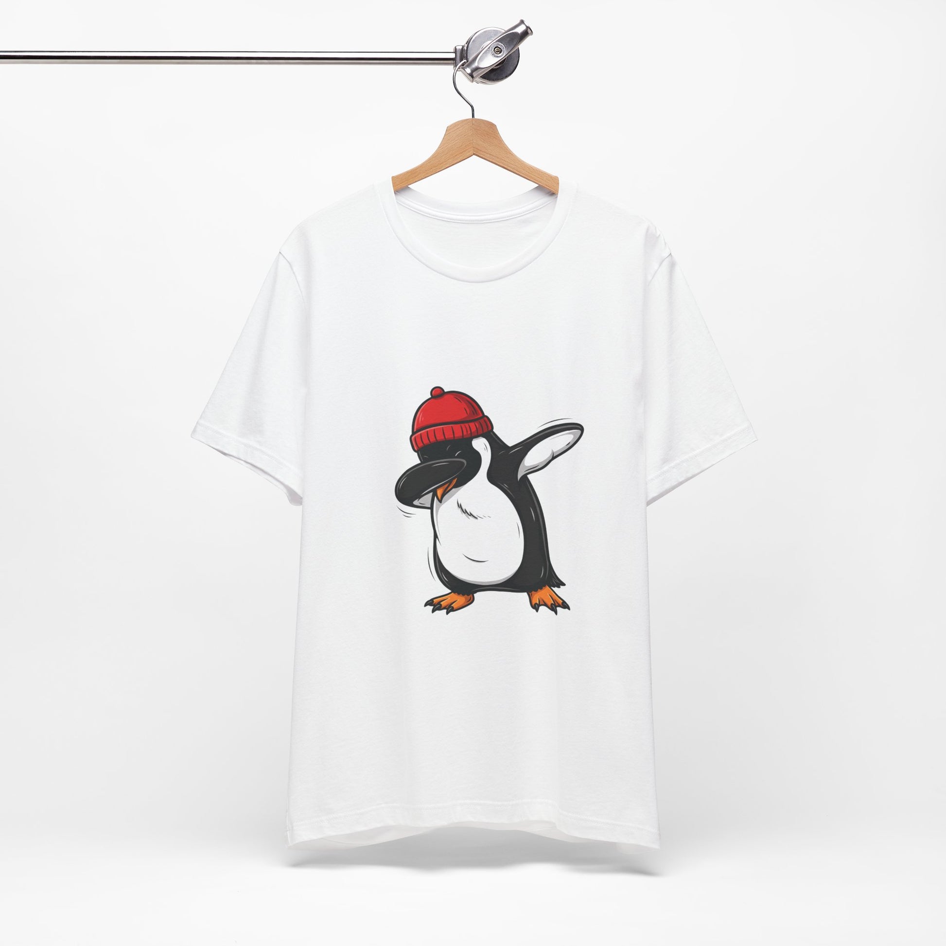 men white short-sleeve crewneck t-shirt hanging on a wooden hanger from a metal rail, featuring a cartoon penguin graphic wearing a red knit beanie | AH Urban Wear PK