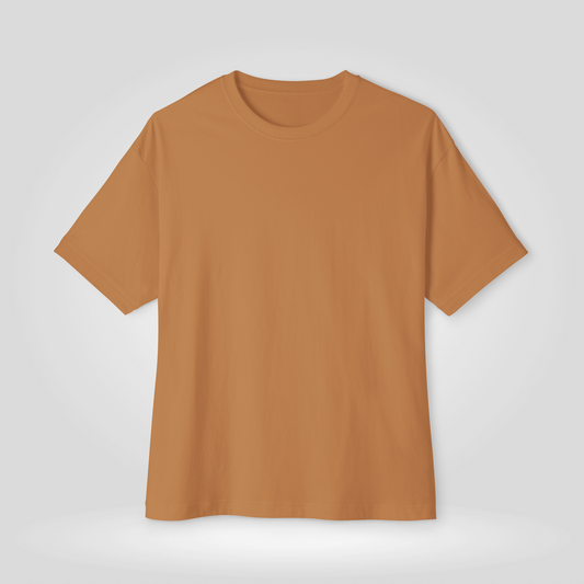 A mens plain drop shoulder t-shirt in a warm camel or ochre color, shown against a light gray studio background | AH Urban Wear PK