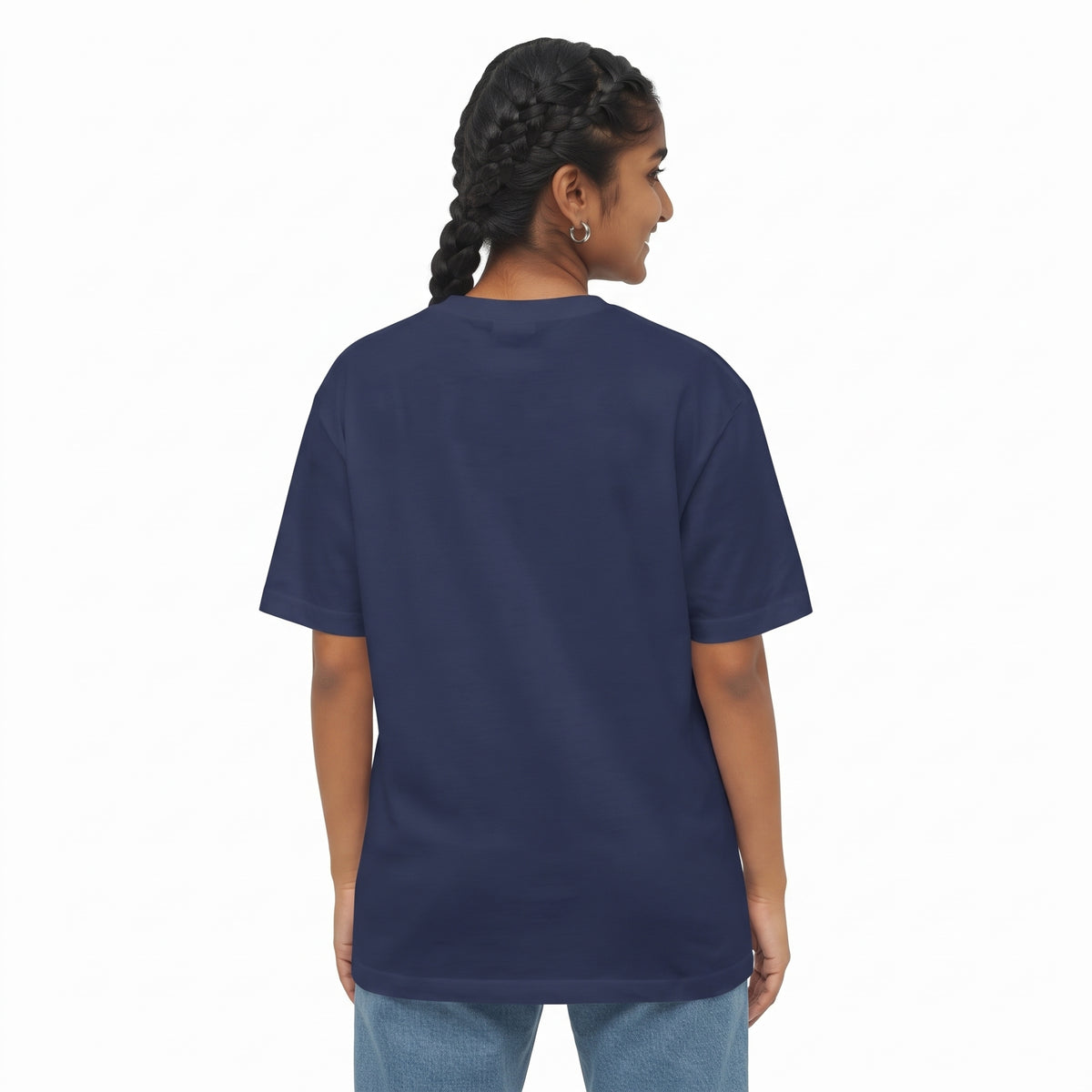 A woman with dark braided hair is shown from the back wearing a navy blue short-sleeve t-shirt and light blue jeans against a plain white background.