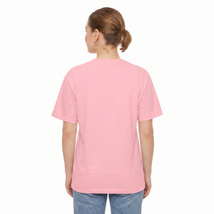 A woman viewed from the back wearing a light pink crew neck drop shoulder t-shirt and blue jeans, set against a plain white background l AH Urban Wear