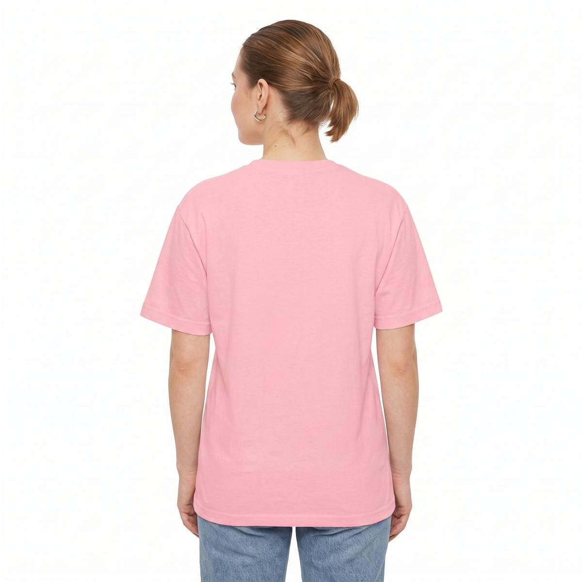 A woman viewed from the back wearing a light pink crew neck drop shoulder t-shirt and blue jeans, set against a plain white background l AH Urban Wear