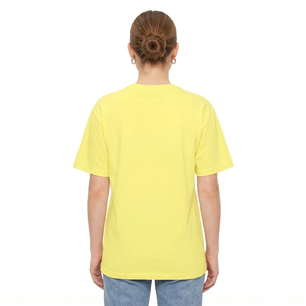 A person viewed from the back wearing a plain drop shoulder yellow T-shirt and light blue jeans against a clean white studio background l AH Urban Wear