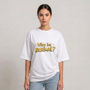 A woman modeling a white drop shoulder t-shirt with a yellow graphic text that reads 'Why be NORMAL?' against a plain light gray background | AH Urban Wear