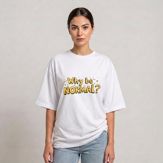 A woman modeling a white drop shoulder t-shirt with a yellow graphic text that reads 'Why be NORMAL?' against a plain light gray background | AH Urban Wear